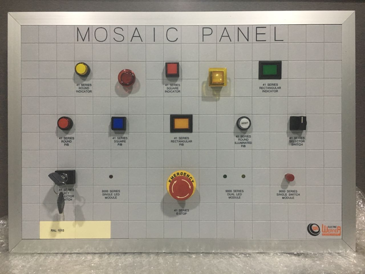 90 Series mosaic panel — demo board with rectangular / round pilot lights, selector switches, key switch, module blocks and an E-stop